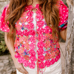 Up close of vest on women wearing white shorts outdoors. 