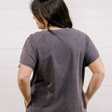 Long dress with embroidery on the shoulder and on the bottom corner showing the back 