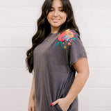Long dress with embroidery on the shoulder and on the bottom corner showing the side and sleeve