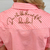 Back up-close view of the brown embroidery on back that says don't be like the rest of the darlin. 
