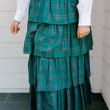 Woman wearing a green/red plaid maxi ruffle skirt with the Renee Top-White. 