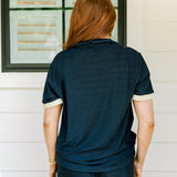 Woman with red hair wearing navy shimmer pants. Model paired this top with Sparkle Top-Navy. 