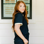 Woman with red hair wearing navy and gold shimmer pants. Model paired this top with Sparkle Top-Navy.