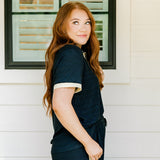 Woman with red hair wearing navy and gold shimmer pants. Model paired this top with Sparkle Top-Navy.