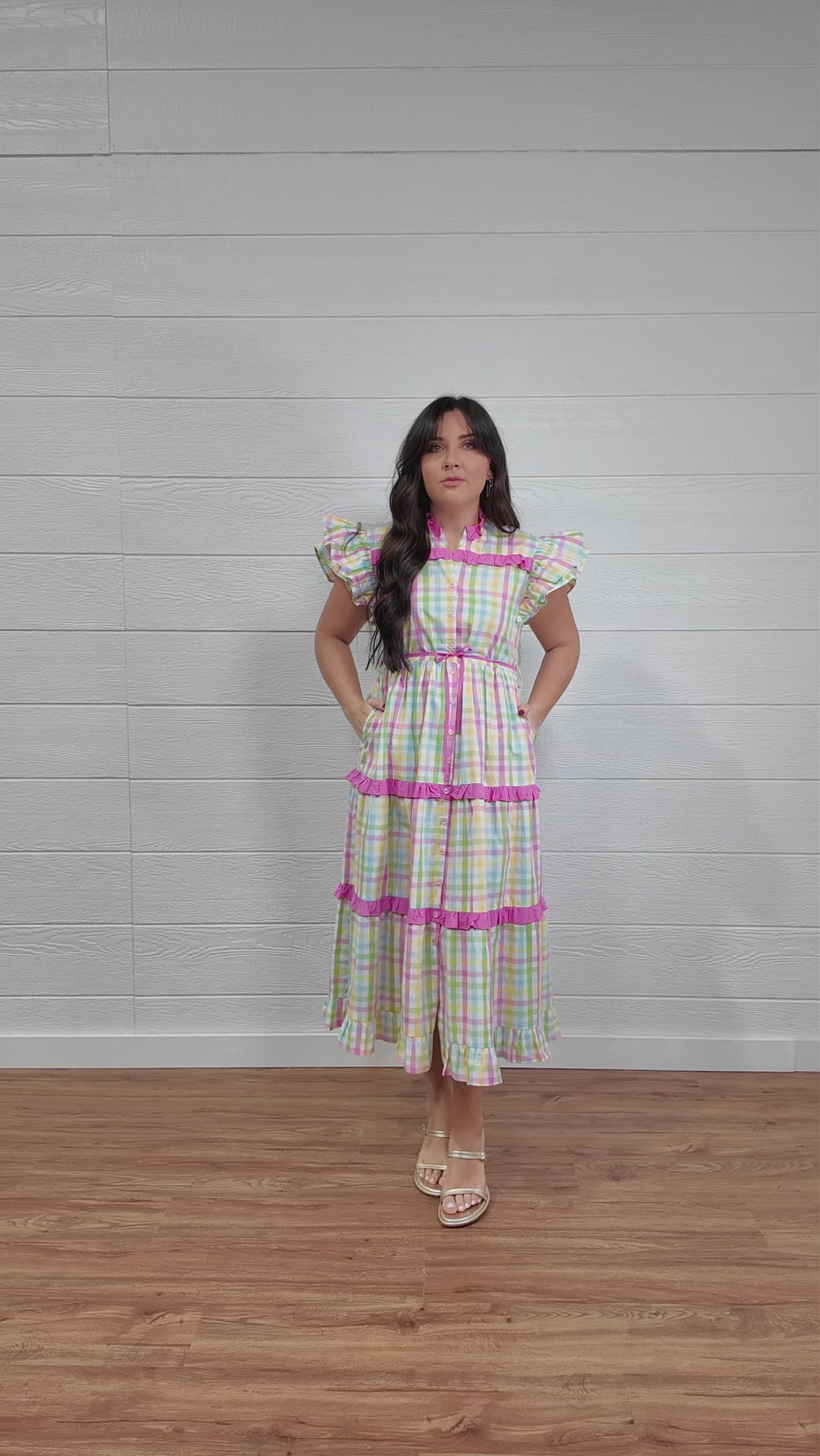 Plaid tiered dress with ruffles and pockets. 