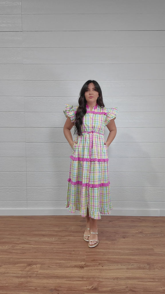 Plaid tiered dress with ruffles and pockets. 
