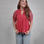 Women wearing a Coral floral top 