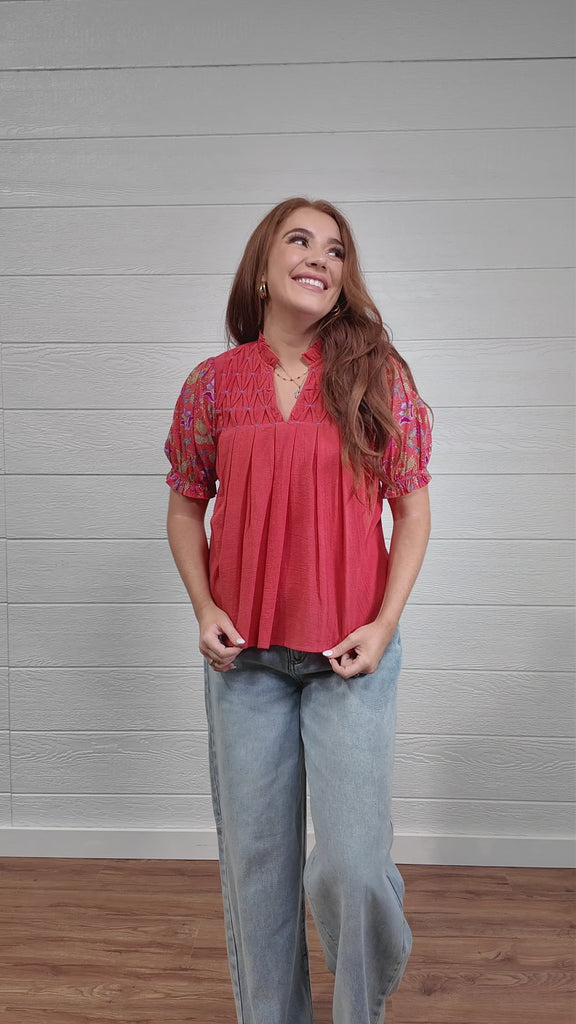 Women wearing a Coral floral top 