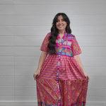 Women wearing mixed media maxi dress that buttons down the front. 