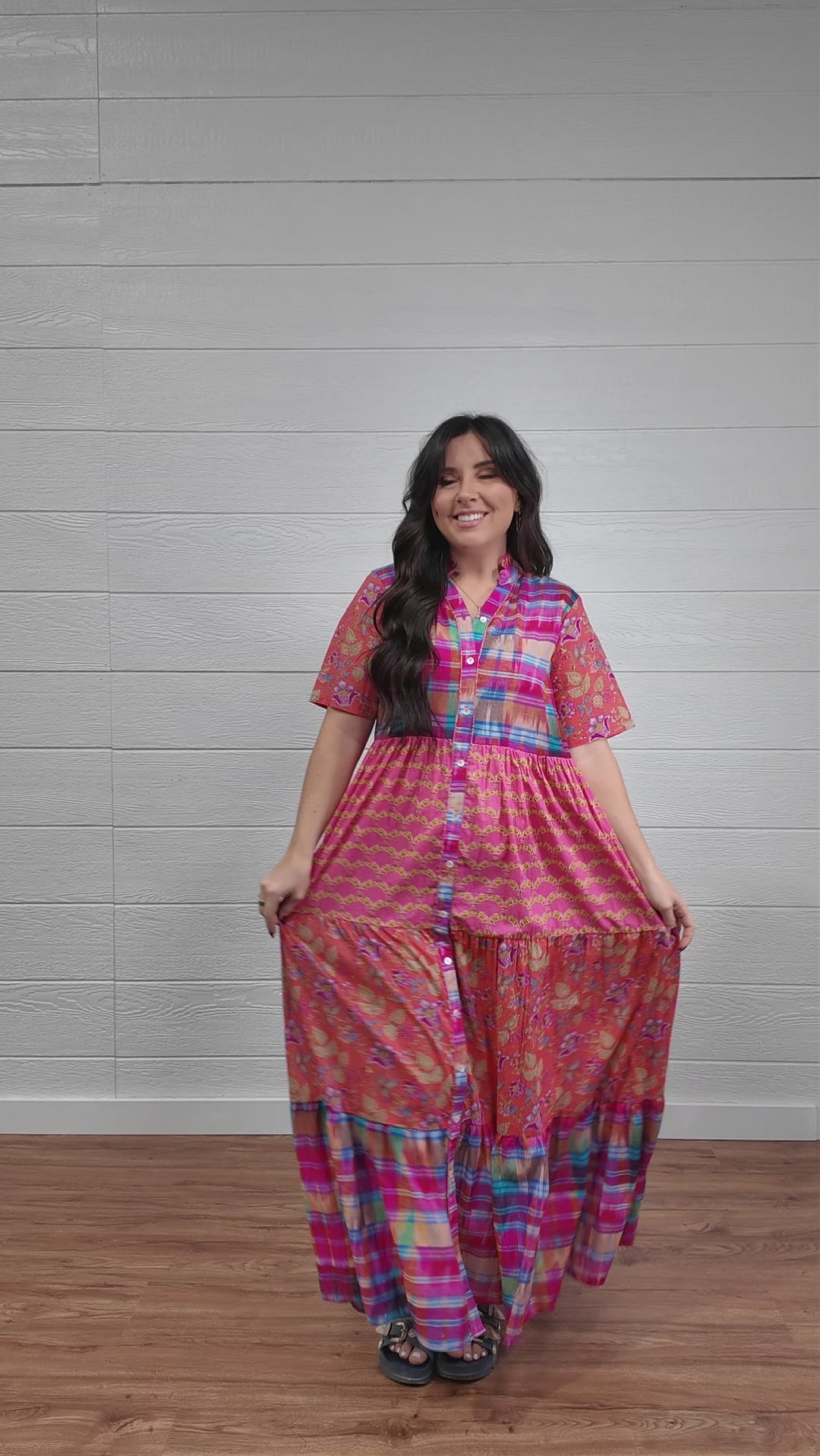 Women wearing mixed media maxi dress that buttons down the front. 