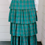 Woman wearing a green/red plaid maxi ruffle skirt with the Renee Top-White. 